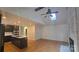 Bright and spacious living room featuring a vaulted ceiling, fireplace, and hardwood floors at 16425 Grapperhall Dr, Huntersville, NC 28078