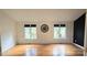 Bright living room with hardwood floors, oversized clock and great natural lighting at 16425 Grapperhall Dr, Huntersville, NC 28078
