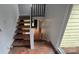 Unique split-level staircase featuring open risers and eye-catching patterned tile at 16425 Grapperhall Dr, Huntersville, NC 28078