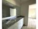 Bathroom with a double sink vanity, granite countertop, and modern fixtures at 168 Wildwood Loop, Statesville, NC 28625