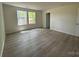 Bright living room with hardwood floors and natural light from two large windows at 168 Wildwood Loop, Statesville, NC 28625