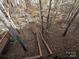 Elevated view of deck and stairs surrounded by woods at 25040 Timberlake Dr, Tega Cay, SC 29708