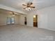 The open basement offers access to the outdoors and a glimpse into the bathroom, maximizing space at 25040 Timberlake Dr, Tega Cay, SC 29708