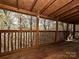 Spacious wooden deck with natural wood beams and open railing provides a great view of the woods at 25040 Timberlake Dr, Tega Cay, SC 29708