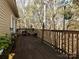 Spacious wooden deck with open railing provides a great view of the woods and the surrounding nature at 25040 Timberlake Dr, Tega Cay, SC 29708