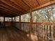 Spacious wooden deck with natural wood beams and open railing provides a great view of the woods at 25040 Timberlake Dr, Tega Cay, SC 29708