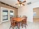 Dining area features wood table with french doors leading to a deck, providing outdoor views at 25040 Timberlake Dr, Tega Cay, SC 29708