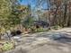 Quaint single-Gathering home with mature trees, landscaped yard, and a welcoming porch at 25040 Timberlake Dr, Tega Cay, SC 29708
