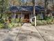 Charming home featuring a well-manicured front yard and inviting front porch at 25040 Timberlake Dr, Tega Cay, SC 29708