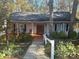 Charming home featuring a well-manicured front yard and inviting front porch at 25040 Timberlake Dr, Tega Cay, SC 29708