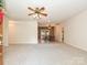 Spacious living room with neutral carpet and ceiling fan at 25040 Timberlake Dr, Tega Cay, SC 29708