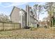 Fenced backyard with patio seating, garden, and mature trees at 3519 Crescent Knoll Dr, Matthews, NC 28105