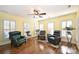 Bright sitting room with hardwood floors and plantation shutters at 6146 Highview Rd, Matthews, NC 28104