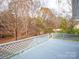 View from the wooden deck overlooking a lush, green backyard at 665 Firecrest Se St, Concord, NC 28025