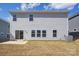 Backyard view of the home featuring an AC unit, sliding glass door, and a patio at 109 Obadiah Ct, Troutman, NC 28115