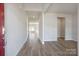 Spacious foyer with light gray wood floors, leading to an open-concept living area at 109 Obadiah Ct, Troutman, NC 28115