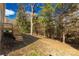 Expansive backyard with lush greenery and a tranquil wooded backdrop with deck access at 1100 Turkey Creek Ridge Rd, York, SC 29745