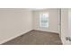 Simple carpeted bedroom with a window and neutral walls at 1100 Turkey Creek Ridge Rd, York, SC 29745