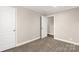 Well-lit bedroom with carpet, offering access to closet at 1100 Turkey Creek Ridge Rd, York, SC 29745