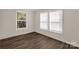 Bedroom featuring two windows, hardwood floors, neutral walls and white trim at 1100 Turkey Creek Ridge Rd, York, SC 29745