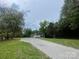 Exterior view of home featuring gravel driveway, ample yard, and mature trees at 1100 Turkey Creek Ridge Rd, York, SC 29745