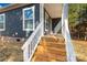 Steps leading up to a charming front porch with white railings at 1100 Turkey Creek Ridge Rd, York, SC 29745