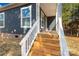 Inviting front porch with new wooden steps and white railings welcomes you home at 1100 Turkey Creek Ridge Rd, York, SC 29745