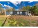 Gray siding, multiple windows, and a small front porch at 1100 Turkey Creek Ridge Rd, York, SC 29745