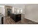 Modern kitchen with island and view into living room at 1100 Turkey Creek Ridge Rd, York, SC 29745