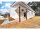 Back porch with wooden pillars and ceiling fan offering a comfortable view of the yard at 1300 Eddie St, Gastonia, NC 28054