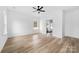 Minimalist bedroom with wood floors, a ceiling fan and ensuite bathroom entrance at 1300 Eddie St, Gastonia, NC 28054