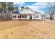 Charming single-story home with white siding, dark shutters, and a welcoming front porch at 1300 Eddie St, Gastonia, NC 28054