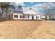Inviting home with traditional details, showcasing white siding, dark shutters, and a well-maintained lawn at 1300 Eddie St, Gastonia, NC 28054