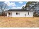 Rear exterior showing the yard with covered patio, seamlessly integrating indoor and outdoor living at 1300 Eddie St, Gastonia, NC 28054
