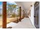 Covered front porch featuring sturdy wooden columns and a view of the landscaped yard at 1300 Eddie St, Gastonia, NC 28054