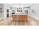 Bright and open kitchen with island seating, white cabinets, and stainless steel appliances at 1300 Eddie St, Gastonia, NC 28054