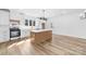 Well-equipped kitchen featuring an island, white cabinetry, and stainless steel appliances at 1300 Eddie St, Gastonia, NC 28054