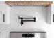 Stylish kitchen featuring white herringbone backsplash, a pot filler, and stainless steel appliances at 1300 Eddie St, Gastonia, NC 28054