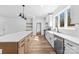 Modern kitchen featuring an island with seating, stainless steel appliances, and white cabinets at 1300 Eddie St, Gastonia, NC 28054