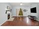 Living room with hardwood floors, fireplace, and TV at 1351 Hollythorn Dr, Rock Hill, SC 29732