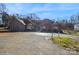 Brick house with a large driveway and mature trees at 1808 Wilton Gate Dr, Charlotte, NC 28262