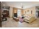 Spacious living room with tiled floors, comfortable seating, and a large TV at 1808 Wilton Gate Dr, Charlotte, NC 28262