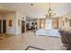Open living room with tile floors and a view of the kitchen at 1808 Wilton Gate Dr, Charlotte, NC 28262