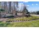 Stone-clad entrance to the Riverchase community featuring flower beds and a decorative sign at 6012 Drave Ln, Fort Mill, SC 29715