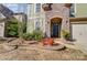 Beautiful home exterior with stone accents, manicured landscaping, and an inviting front door at 6012 Drave Ln, Fort Mill, SC 29715