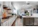 Modern kitchen featuring stainless steel appliances, granite countertops, and hardwood flooring at 6012 Drave Ln, Fort Mill, SC 29715