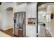 Kitchen with stainless steel appliances, white cabinets, granite countertops, and hardwood flooring at 6012 Drave Ln, Fort Mill, SC 29715