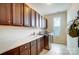 Laundry room with upper and lower cabinets, a sink, and stainless steel appliances at 6012 Drave Ln, Fort Mill, SC 29715