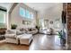 Bright living room featuring high ceilings, large windows, and hardwood floors at 6012 Drave Ln, Fort Mill, SC 29715