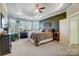 Main bedroom with tray ceiling, bay windows, and ensuite bathroom at 6012 Drave Ln, Fort Mill, SC 29715